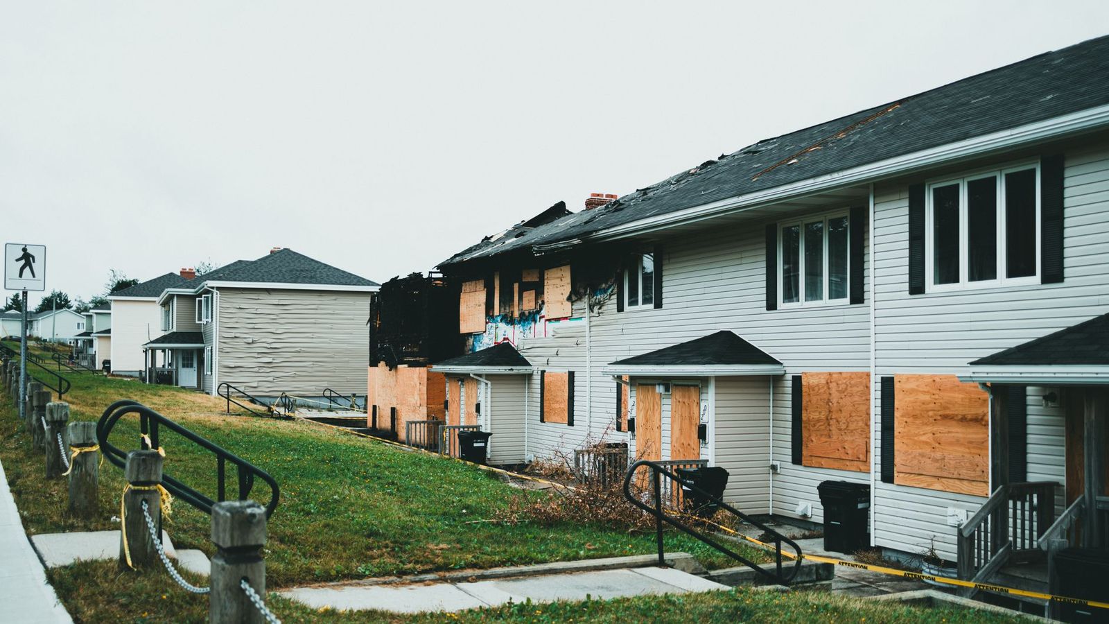 Fire-damaged residential buildings, representing the kind of property loss covered by a fire insurance claims investigation