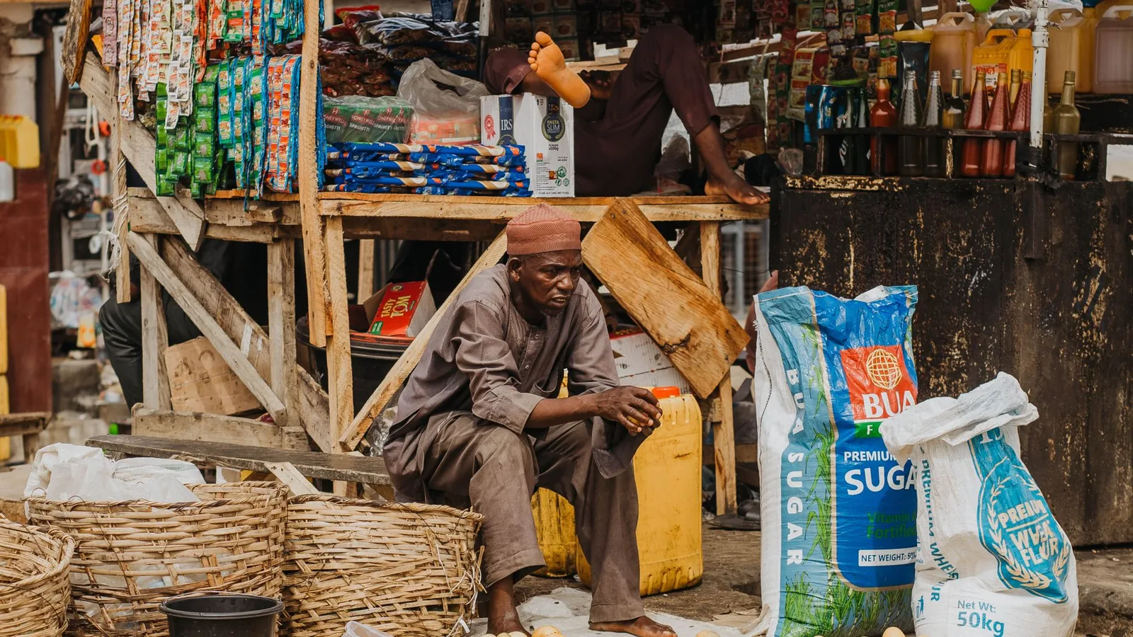 A local market stall selling branded packaged goods, representing brand and intellectual property risk in a new market