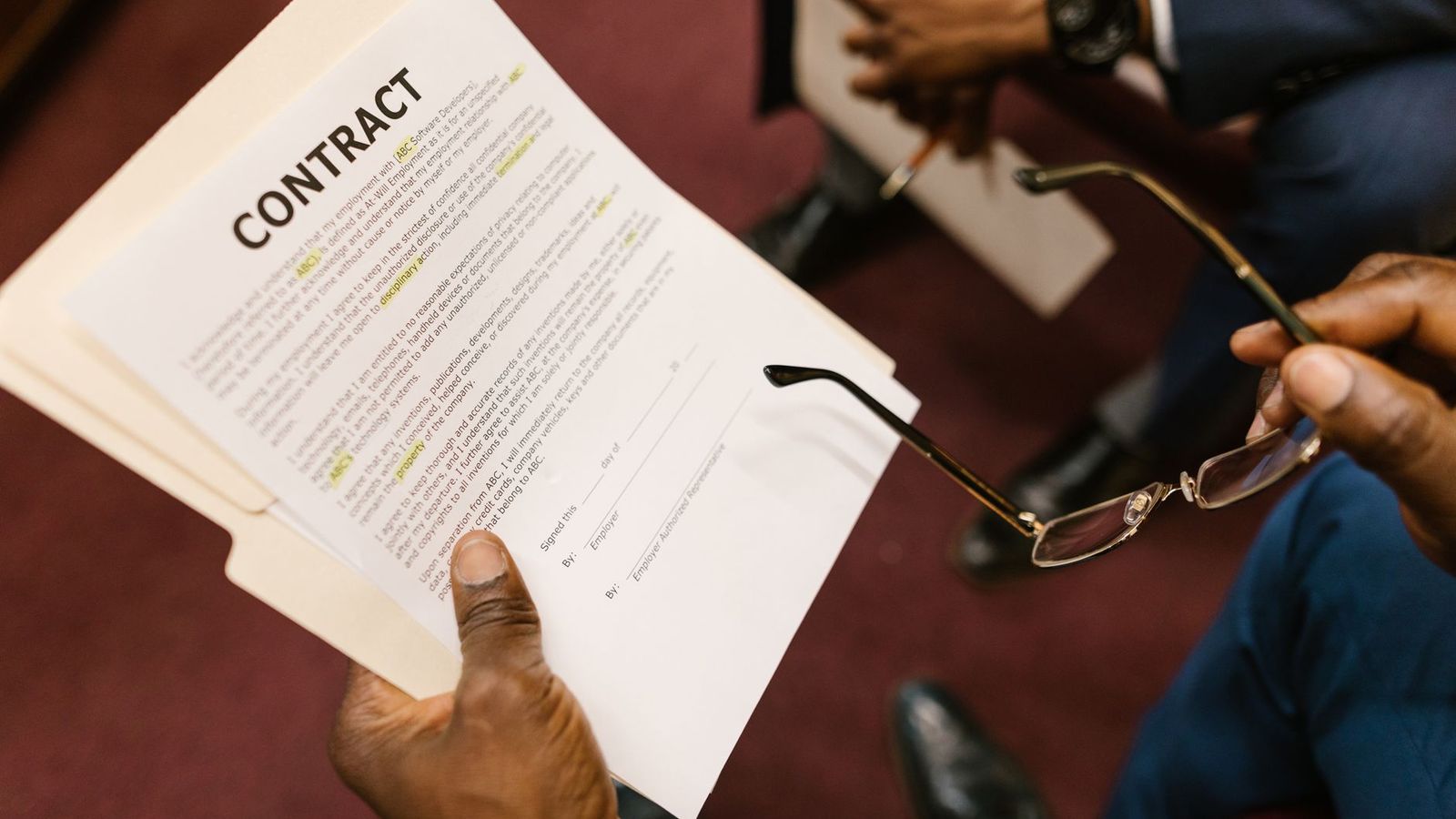 Businessman reviewing a signed contract during a partner due diligence check