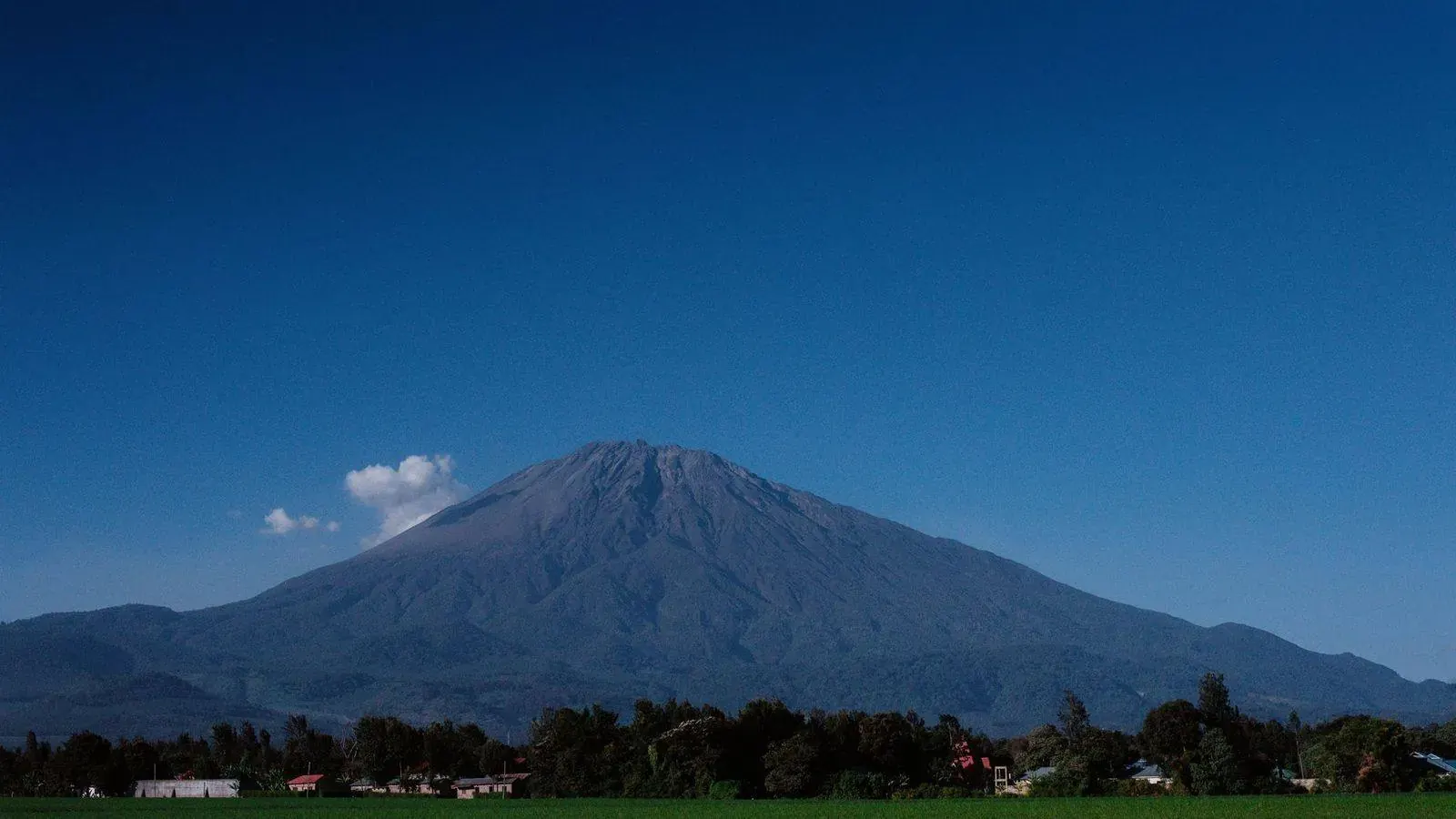 Mount Meru rising above the Arusha countryside in Tanzania