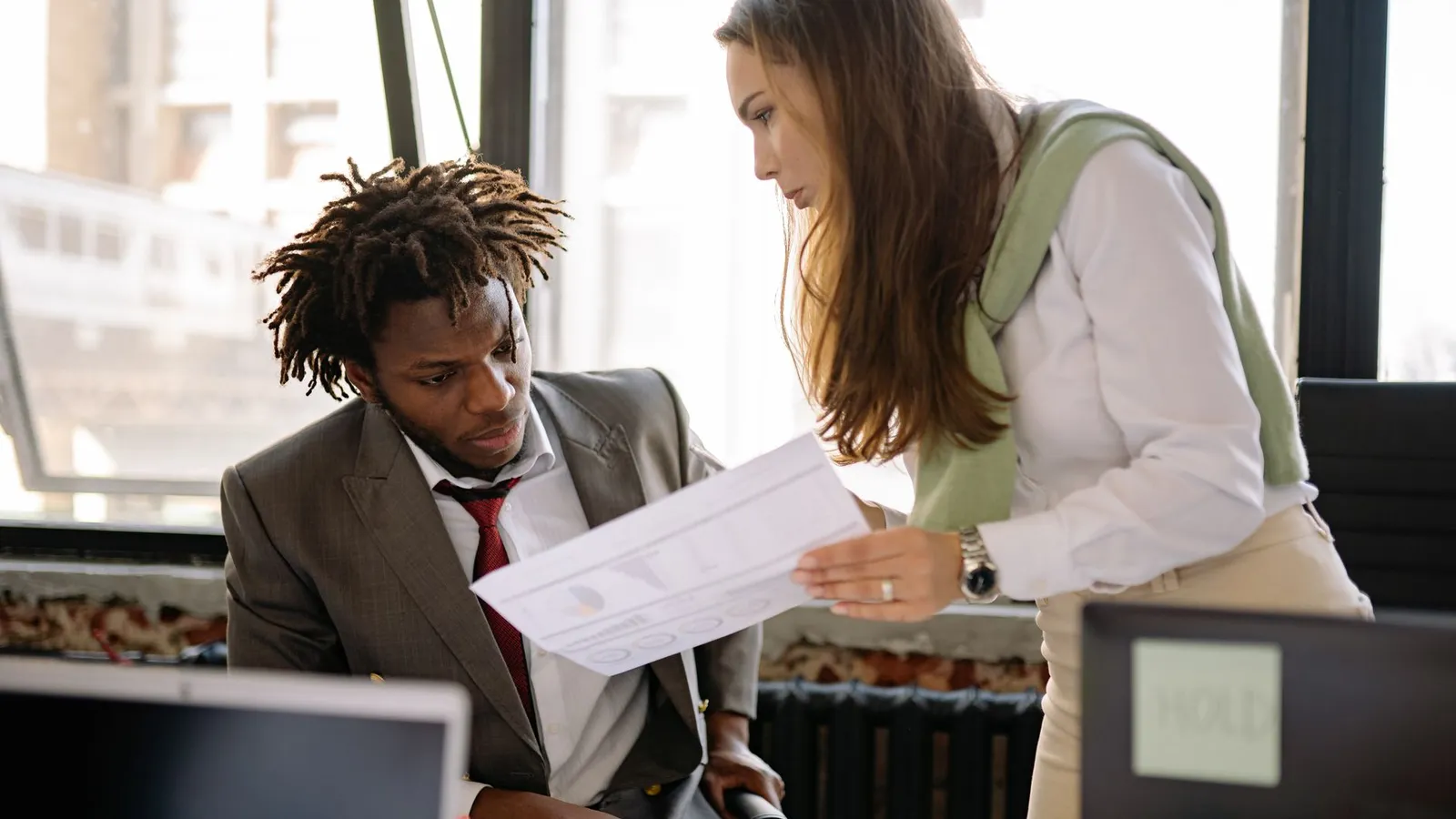 Two colleagues reviewing a case document together in an office, representing a firm's experience with a specific type of case
