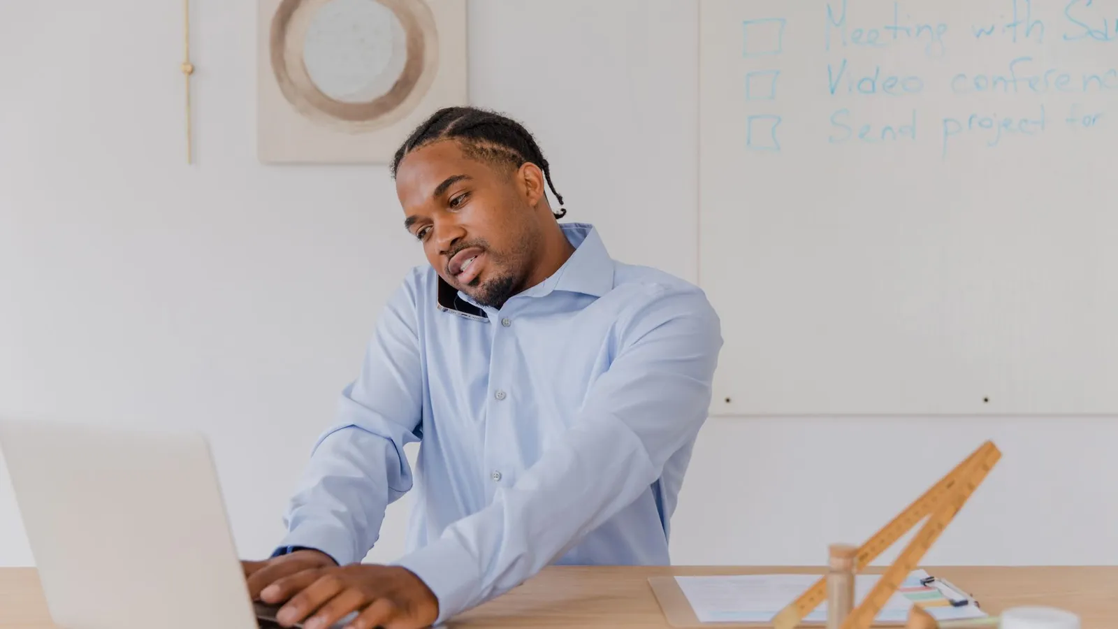 A man working at a laptop in an office, representing the timeline and next-step questions worth clarifying before a case begins