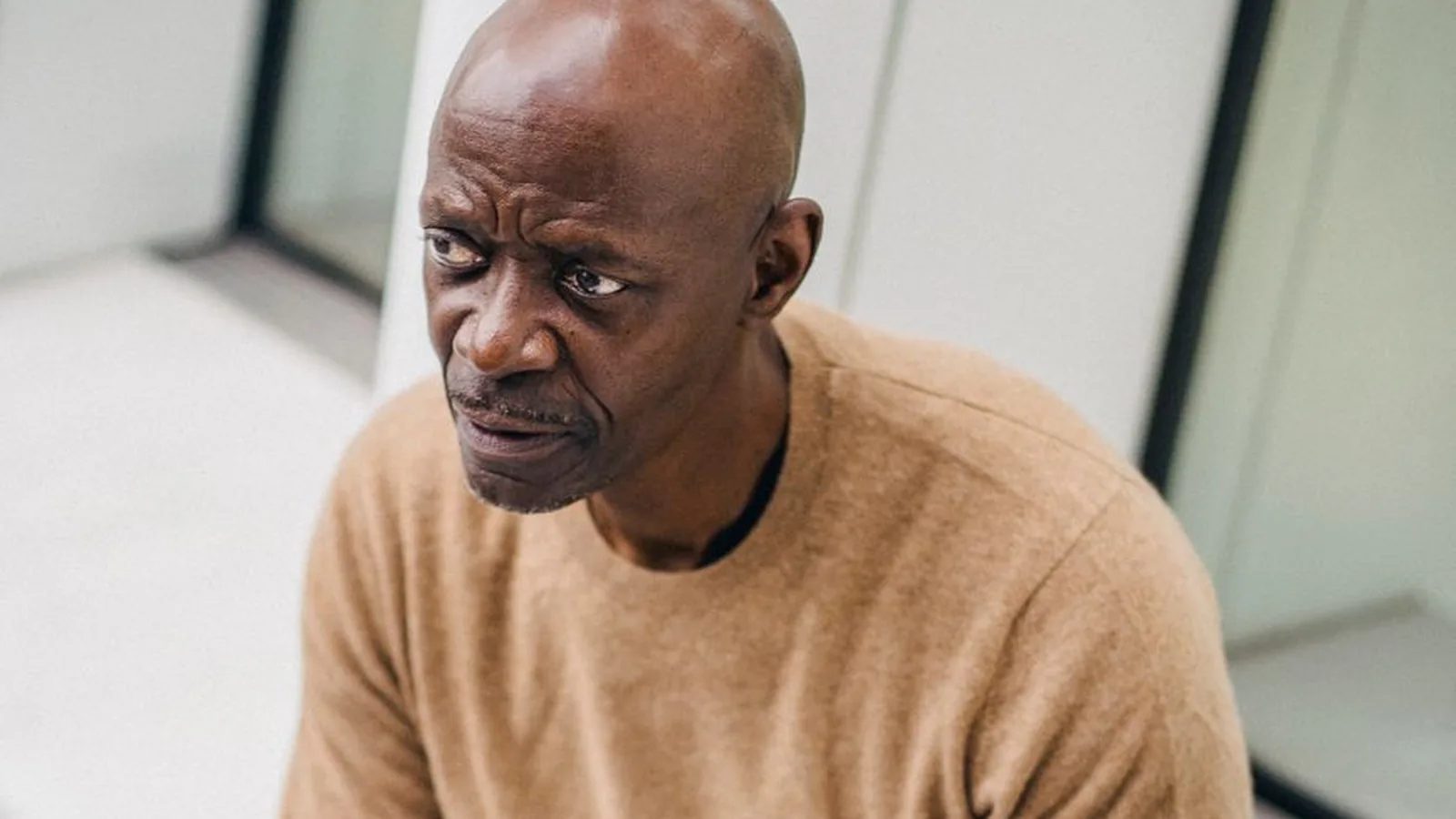 A man with a suspicious, concerned expression, representing the moment a competitor seems to know something they shouldn't